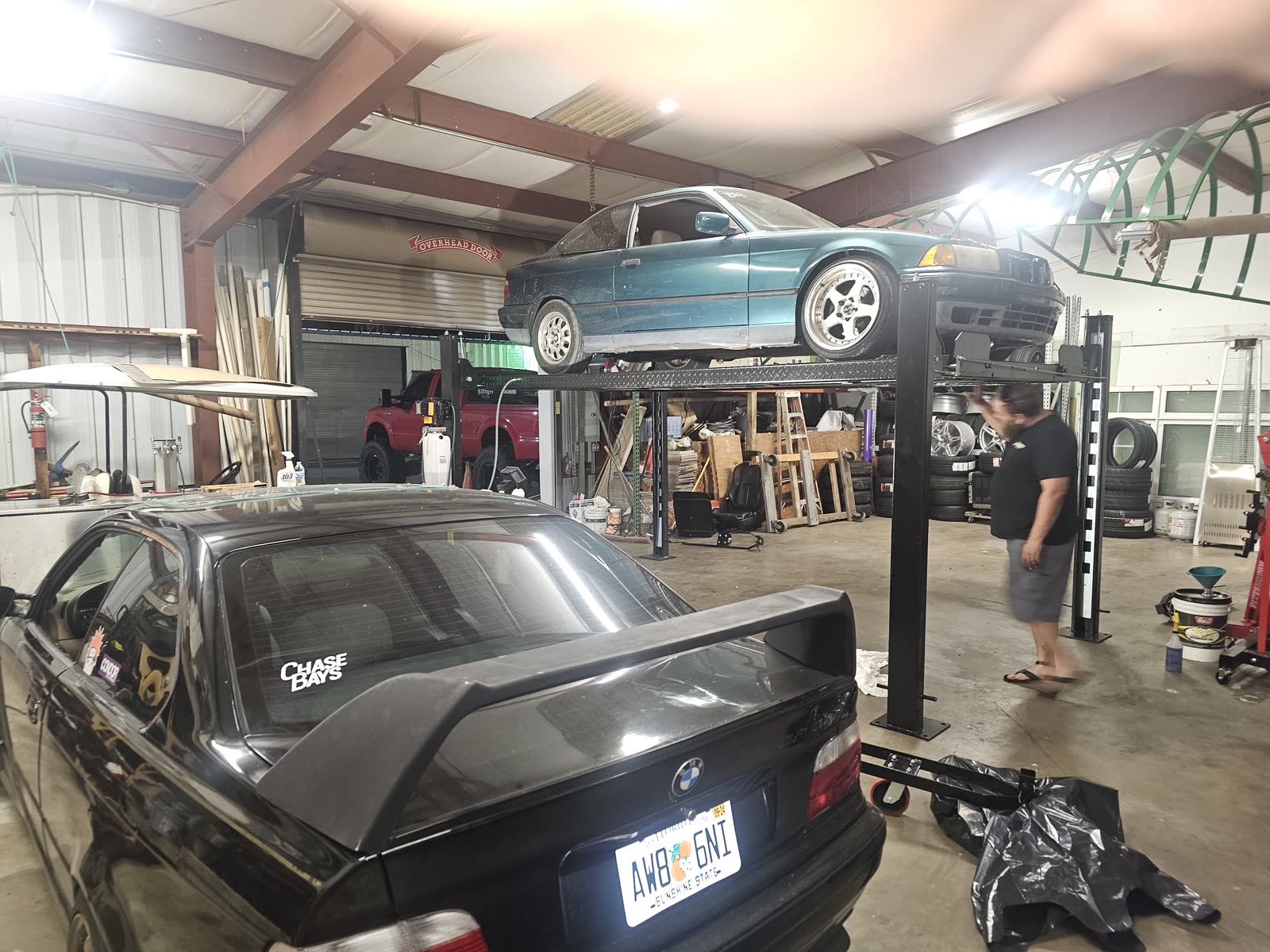 BMW E36 project cars stacked on the lift
