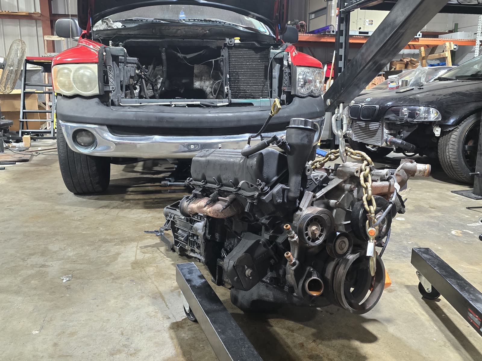 Engine pulled from a pickup truck for repair