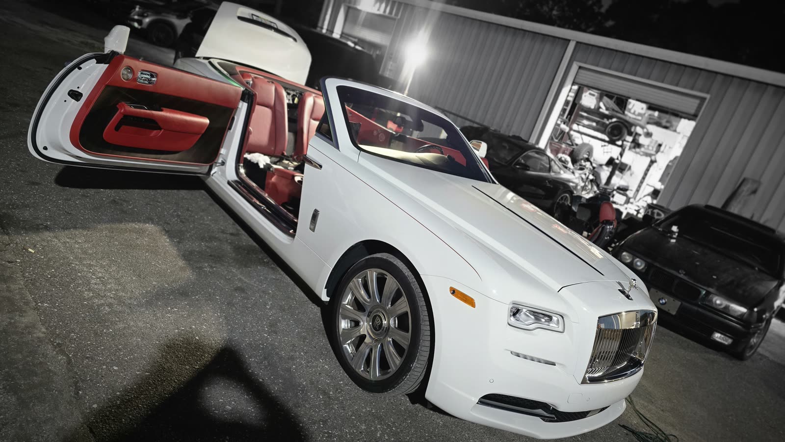 Rolls-Royce Dawn outside the shop at night