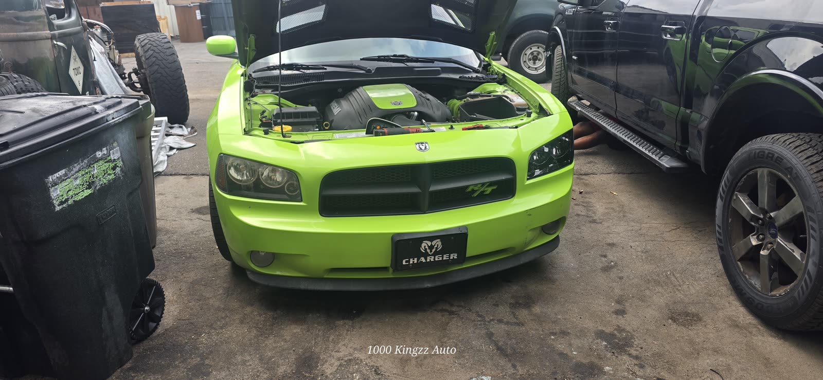 Green Dodge Charger in for service