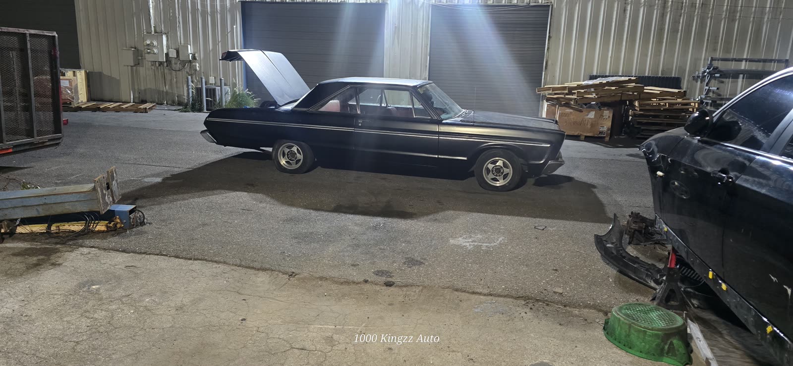 Classic Chevy in the shop at night