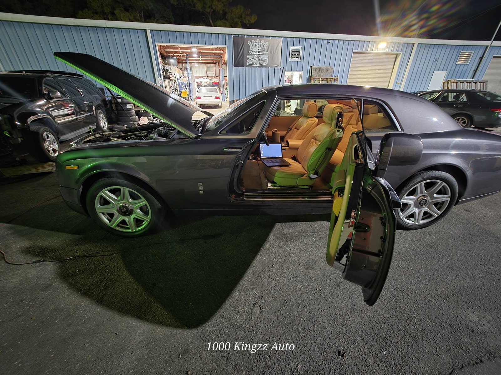 Two-tone Rolls-Royce in for work, doors open