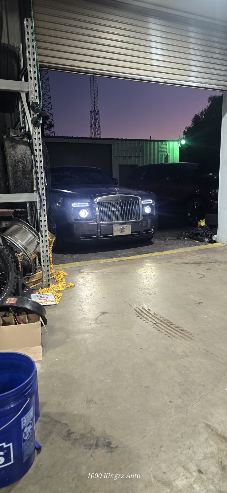 Rolls-Royce at the shop door at night