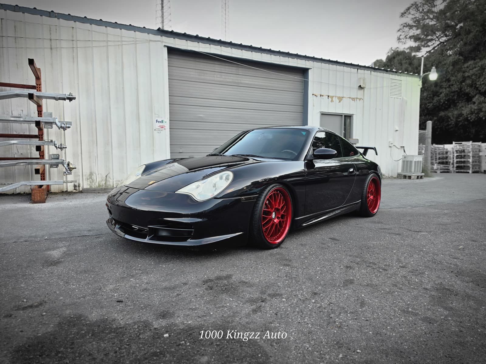 Black Porsche 911 GT3 outside the shop